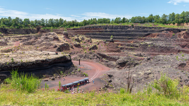 Interior of the french volcano Lempt&eacute;gy, formely used as a quarry, located in the &ldquo;Chaine des Puys&rdquo;. The famous lava dome "Puy de d&ocirc;me" appears in the background.