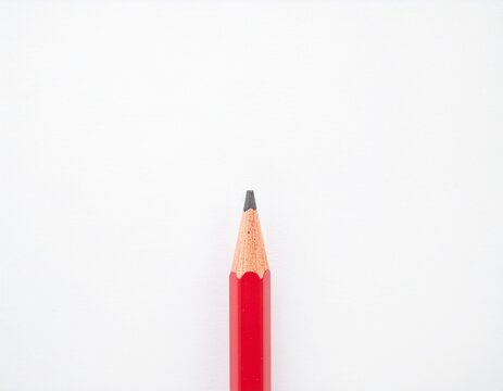Short red pencil. Still life of short. Red Pencil on White Background.