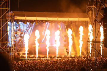 Crowd at concert and blurred stage lights.