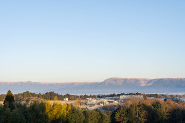 the view of Mount Aso and it's community