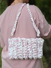 pink and white knitted bag made of knitted yarn. shoulder bag