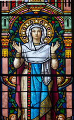 Stained glass (19th century) of Virgin Mary at prayer.