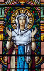 Stained glass (19th century) of Virgin Mary at prayer.