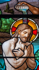 Stained glass (1920) of Baptism of Jesus by John the Baptist in the Jordan river.