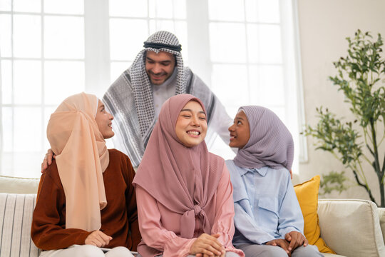 Muslim family talk together at home communication in islamic culture love happy moment, diverse group wearing hijabs dress, ramadan or eid, islamic family financial planning, halal insurance support - Powered by Adobe