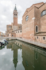 san Carlo church side and belltower, Chioggia, Italy