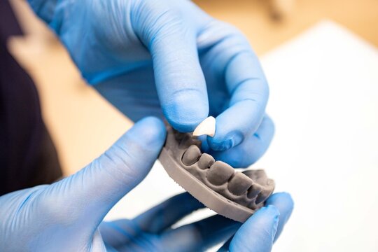 close-up of dentist hand with dental tools