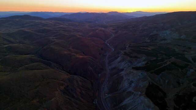 the sunset over the mountains and the international highway - Powered by Adobe