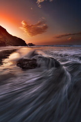 sunrise on the beach at Pantai Pecaron Kebumen Central Java Indonesia