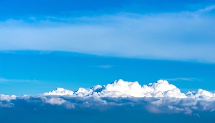 Vast blue sky with puffy clouds