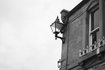 Vintage street lantern on house wall, heritage architecture, timeless and vintage charm. Lighting, decor or vitange design projects
