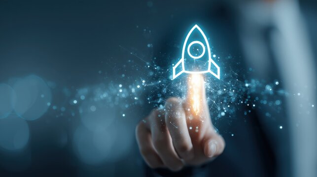 Business hand points to glowing rocket hologram on dark background. Useful for startup launches, innovation slides, websites, and ads about acceleration, progress, vision, and business growth.