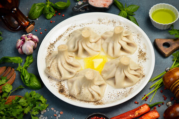 Boiled khinkali with lamb or beef or cheese. Traditional Georgian dish khinkali. Hinkali on a plate.