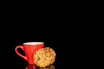 Thaler cookies with nuts and honey isolated on black background, close-up.