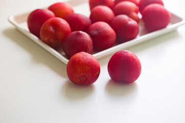 Red plums, isolated on white background