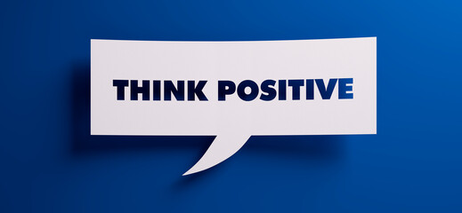 White speech bubble with the words think positive in front of a blue colored wall - 3D illustration