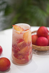 Natural red plum juice isolated on white background.
