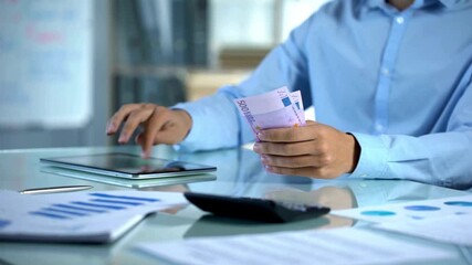 Successful transaction, capital investment. closeup of businessman hands counting euro money banknotes. Unrecognizable businessman counts euro money. A man in suit holding and counting Euros, close up - Powered by Adobe