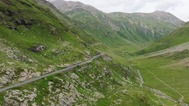 Aerial drone view Forcola di Livigno mountain road Italy Switzerland border Alps