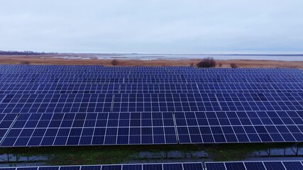 Cinematic view, solar panels near Liepaja lake symbolize renewable green energy - Powered by Adobe
