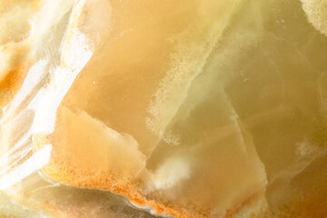 polished surface of calcite onyx rock close up
