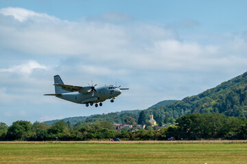 Military transport turboprop aircraft landing maneuver