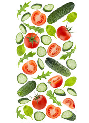 Organic vegetable salad ingredients as flying straight flow in art composition, isolated. Red tomatoes, green cucumbers, mixed greens. Vegetarian diet food, detox cooking, fitness diet, advertising.