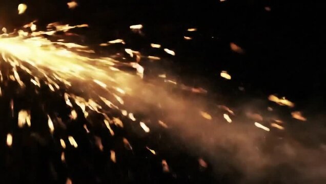Dynamic sparks fly against a deep, dark background, suggesting a raw display of industrial activity. It evokes a sense of action and heat, with its glowing particles creating patterns and traces.
