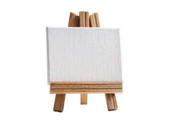 Miniature blank canvas on wooden easel against a transparent background for creative concepts