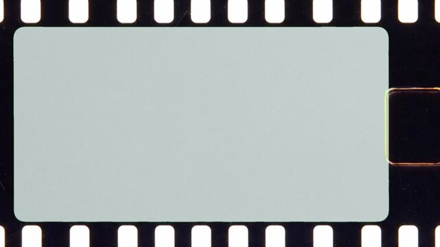 Blank 35mm film strip scrolling isolated on white background