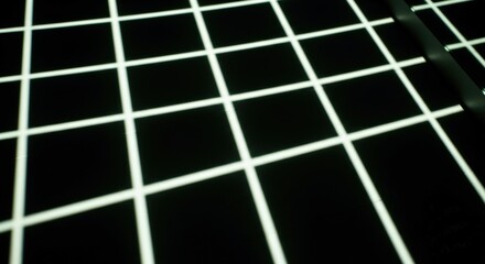 A grid pattern with white lines on a black background, creating a geometric design.