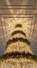 Magnificent chandelier with intricate design, casting beautiful light patterns on the ceiling.