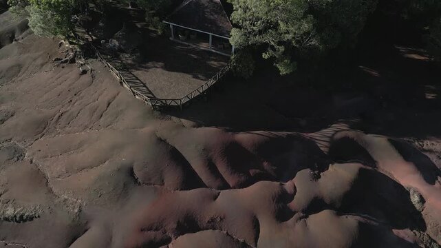 Aerial view of the dramatic, undulating landscape of Seven Colored Earth Geopark, where earthy reds and browns blend seamlessly, Chamarel, Rivi&egrave;re Noire District, Mauritius.