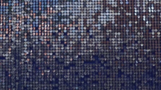 abstract background of silver disks suspended on strings. sparkling 