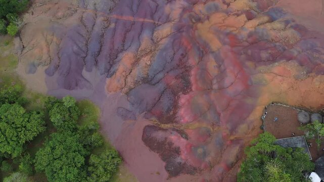 Aerial view of the vibrant, undulating landscape of the Seven Colored Earth Geopark, showcasing a spectrum of colors, Chamarel, Rivi&egrave;re Noire District, Mauritius.