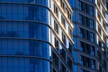 Glass balconies in multi-family buildings, apartment density, real estate, and housing market.