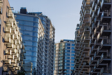 Glass balconies in multi-family buildings, apartment density, real estate, and housing market.