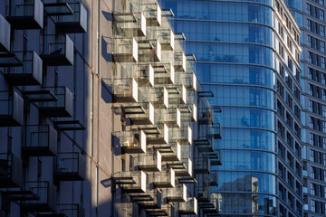 Glass balconies in multi-family buildings, apartment density, real estate, and housing market.