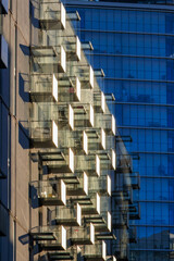 Glass balconies in multi-family buildings, apartment density, real estate, and housing market.