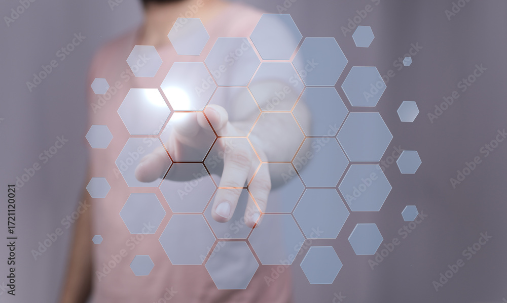 Aufkleber abstract image of a hand interacting with a futuristic hexagon technology interface. perfect for tec