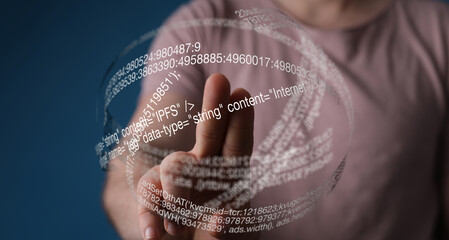 Person's finger interacts with a holographic globe displaying code and data, symbolizing digital interaction and technology.