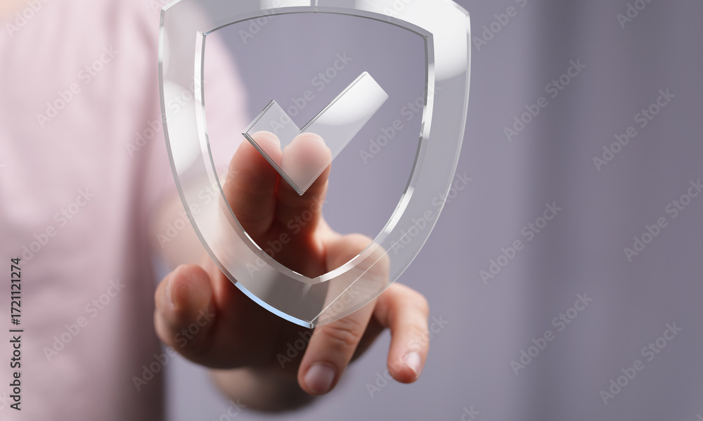 Poster hand interacts with a transparent shield graphic, symbolizing data protection and security.