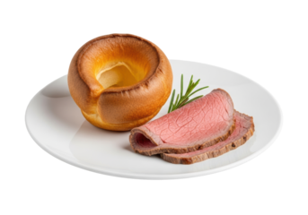 Single, golden-brown yorkshire pudding and succulent roast beef slice with a rosemary sprig on a white plate, isolated on transparent, clean minimalist gourmet meal presentation