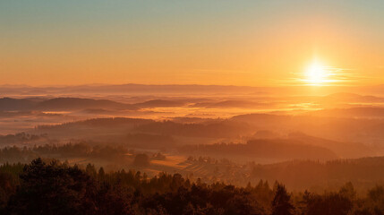 Obraz premium Golden Sunrise Panorama: A breathtaking panoramic shot of a stunning sunrise painting the sky with warm golden hues, as the sun ascends over a vast, serene landscape.