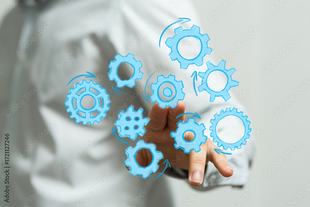Poster abstract image of gears rotating around a hand, symbolizing teamwork, collaboration, and progress.