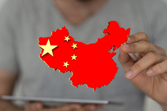 Hand holding 3D China map, symbolizing growth, investment, and global trade. Perfect for business, finance, and economic concepts.