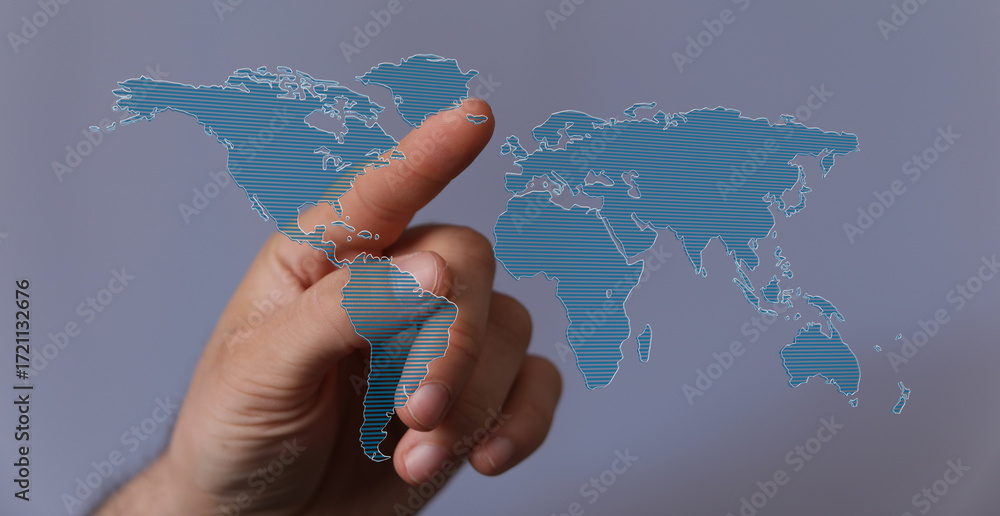 Poster high-quality stock photo depicting a hand interacting with a digital world map, symbolizing global c