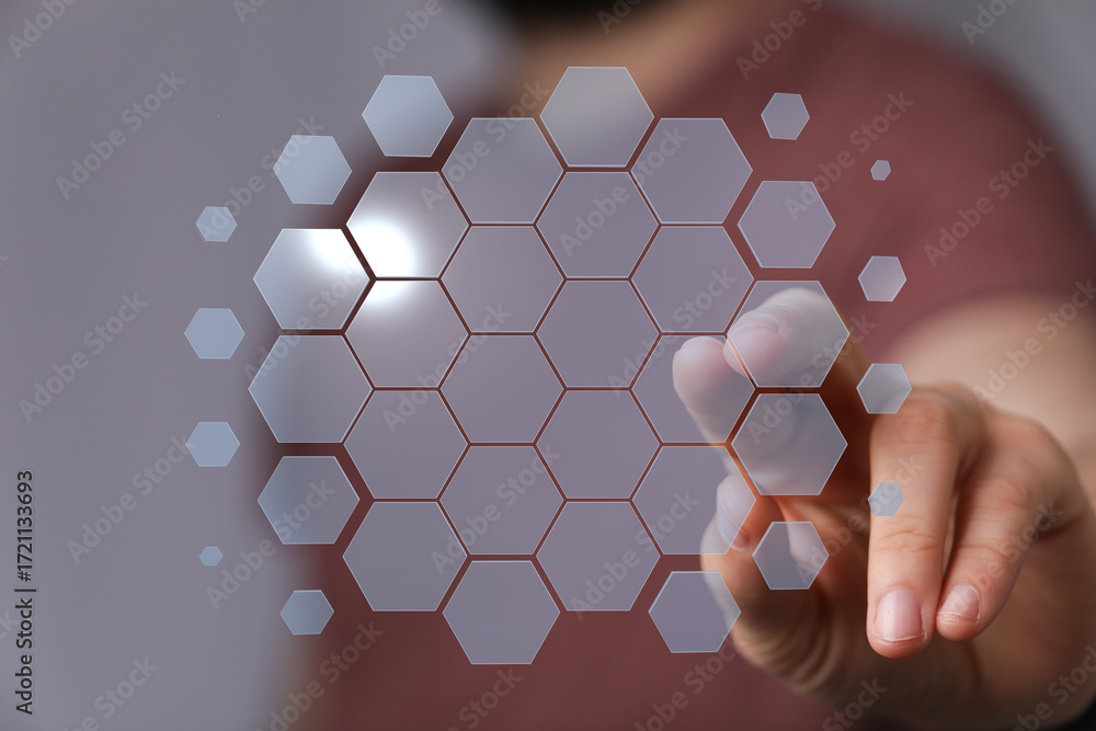 Poster abstract image of hand interacting with a digital hexagon network. perfect for technology, innovatio