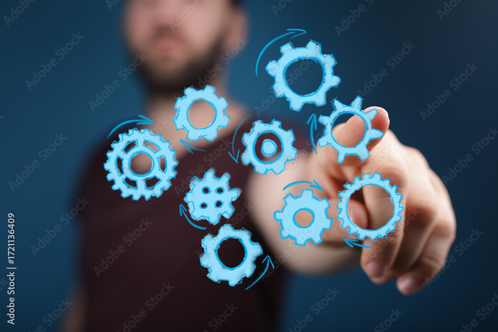 Poster abstract image of a man interacting with digital gears, symbolizing teamwork, collaboration, and pro