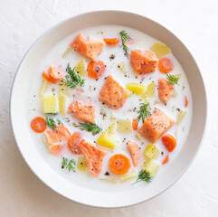 Finnish fish soup lohikeitto with salmon and vegetables. National cuisine. Healthy eating.
